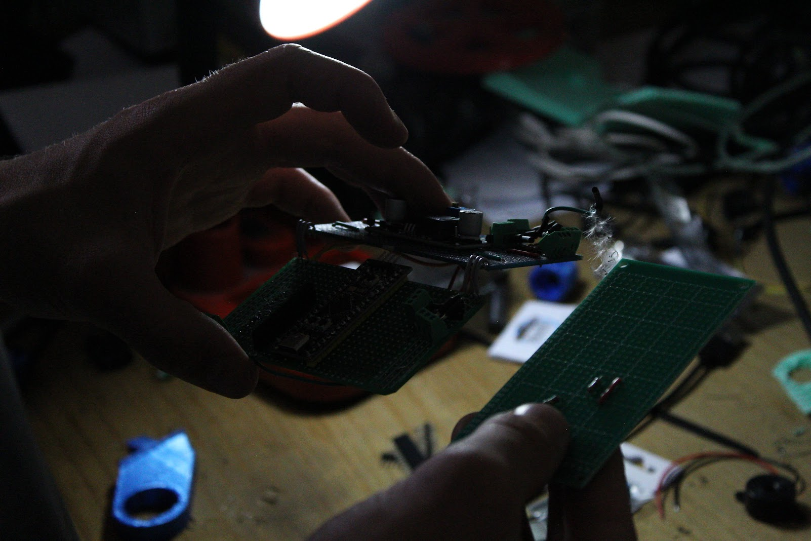 A POSITECH technician assembling vending machine electronics